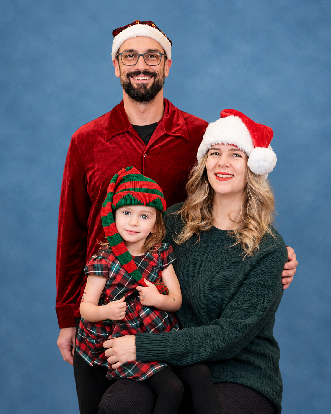 November 24th, 2026-Cleveland Elementary-Holiday Family Portrait Fundraisers  | Festive_Family_Portrait_on_Blue_Fabric_Background.png